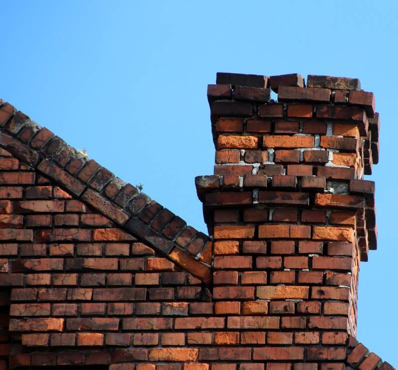 Signs Your Hammond Home Needs a Chimney Inspection Damaged chimney on an Hammond home showing cracks and missing mortar